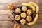 Homemade diet muffins with blueberries and bananas close-up on a slate board. horizontal top view