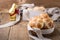 Homemade Easter hot cross buns in wooden bowl