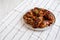 Homemade Easy Sticky Chicken Drumsticks on a Plate, low angle view. Space for text