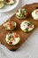 Homemade Egg White Breakfast Cups with Spinach and Tomato, side view