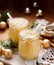 Homemade Eggnog, traditional Christmas drink served with whipped cream and nutmeg