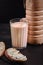 Homemade fermented baked milk in transparent bowl on an old dark background. Rustic. Milk products. Background image