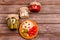 Homemade fermented products on a plate - sauerkraut, tomatoes, pickles on a wooden background