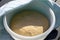 Homemade fesh yeast dough in a bowl before baking