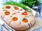 Homemade focaccia with organic yellow cherry tomatoes and dried rosemary