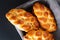 Homemade food concept fresh baked bread braid challah dough in bread basket with copy space