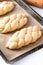 Homemade food concept process proved bread braid challah dough on white background with copy space
