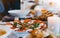 Homemade food salad with tomato, mozzarela, basilica on wooden board on kitchen table, blur concept, spanish or  italian breakfast