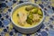Homemade food thai style green curry with grey fishballs, coconut milk and chillies in bowl