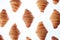 Homemade french croissants pattern on a white background.