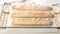 Homemade fresh mouth-watering sourdough baguettes. Homebaked bread. Horizontal shot