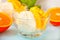 Homemade fresh orange ice cream with orange slices. Summer dessert.