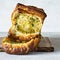 Homemade fresh pull apart bread with herbs parsley, thyme, rosemary, dill, garlic, cheese and spicy butter