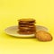 Homemade freshly baked sesame cookies on a yellow background. Keto gluten-free pastries