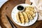 Homemade fried Asian potsticker dumpling appetizer. Gyzo Asian Pork Potstickers with Soy Sauce.