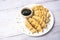 Homemade fried Asian potsticker dumpling appetizer. Gyzo Asian Pork Potstickers with Soy Sauce.