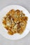 Homemade Fried Hashbrowns on a white plate, overhead view. Flat lay, top view, from above