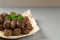 Homemade fried meatballs with herbs on a grey background. Swedish traditional cuisine