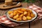 Homemade fried potato on plate sackcloth fresh food. Generate Ai