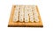 Homemade Frozen Pelmeni on Wooden Board. Isolated on white background