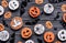 Homemade funny spooky scary cookies pumpkins on happy Halloween background