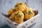 Homemade garlic cheese biscuits on wooden background.