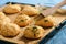 Homemade garlic cheese biscuits on wooden background.