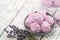 Homemade gentle lavender marshmallows on a blue plate and lavender flowers on kitchen table. Glass jar of natural marshmallows