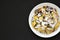 Homemade german Kaiserschmarrn pancake on a black background, top view. Flat lay, overhead, from above. Copy space