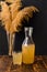 Homemade ginger kombucha or kvass in a bottle. A healthy fermented, prebiotic drink. Dark, wooden background in rustic
