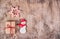 Homemade gingerbread cookie and gift box on wooden background. Handmade holiday sweets. Christmas cookies. Copy space.