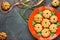 Homemade gingerbread cookie for Halloween or Thanksgiving. Pumpkin cookies for kids on orange plate