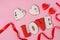 Homemade gingerbreads with letters LOVE for Valentine`s Day located on a pink background, Top view