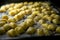 Homemade Gnocchi Pasta Resting on Cookie Sheet