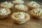 Homemade Goat Cheese Tarts on a Wood Board