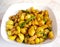 Homemade Gooseberry or amla Pickle or Aavle ka Achar in a bowl or barni over moody background.