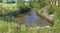 Homemade granite stones pond among the ruins of an ancient no n