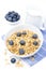 Homemade granola, blueberries and milk, isolated