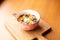 Homemade granola bowl with greek yogurt and blueberries on brown background, top view. Healthy energy breakfast or snack