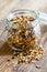 Homemade granola in open glass jar