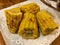 Homemade Grilled and Buttered Golden Corn Cobs with Butter, Red Pepper Powders and Black Pepper.