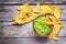 Homemade guacamole with corn chips top view