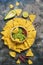 Homemade guacamole with nachos on a rustic background, top view. Mexican food.