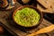 Homemade guacamole sauce in a rustic bowl