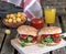 Homemade hamburgers with tomatoes, onions and pickles