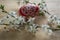 Homemade handmade painted Easter eggs on birch wooden table decorated with blackthorn sloe branch