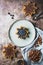 Homemade hazelnut chocolate butter spread on star shaped pieces of pandoro panettone with blueberries in a plate