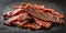 Homemade healthy beef jerky with salt and pepper close up view on dark background AI-Generated Content