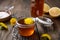 Homemade healthy dandelion syrup in a glass bottle, decorated with fresh flowers