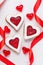 Homemade heart shaped cookies gift with jam and red ribbons for